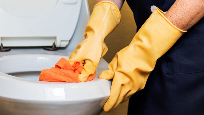 clean the toilet with scrubbing cloth